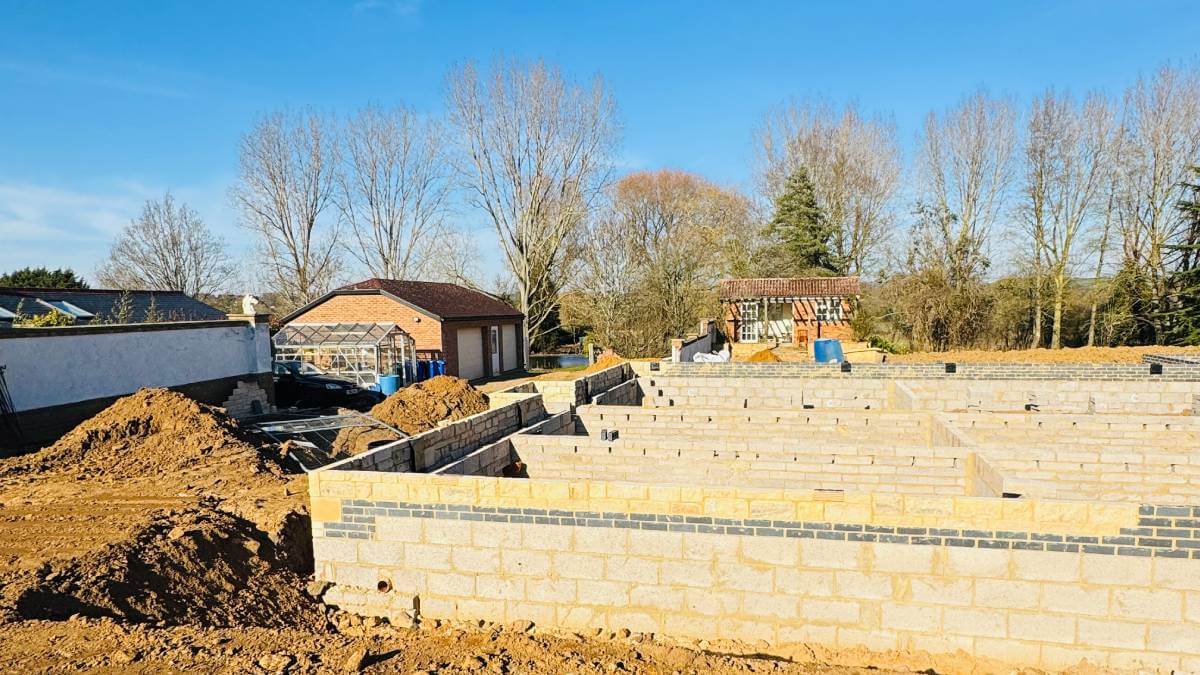 Construction image of a wall being built